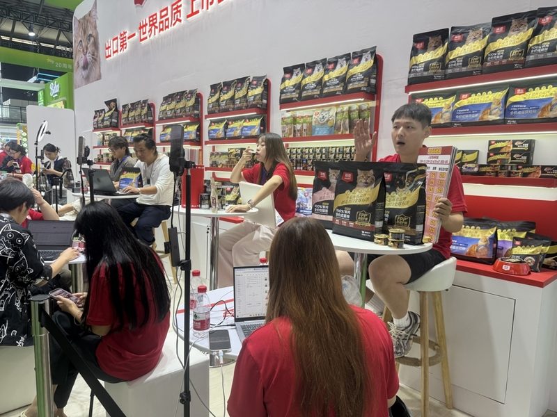 Pet food booth, where exhibitors are live-streaming to promote new products